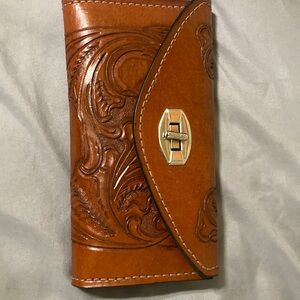 Brown Embossed leather wallet. Check book.